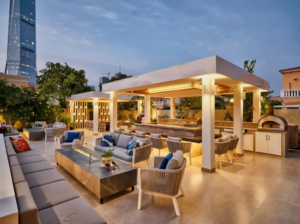Pergola integrated with garden landscaping and paving in Dubai